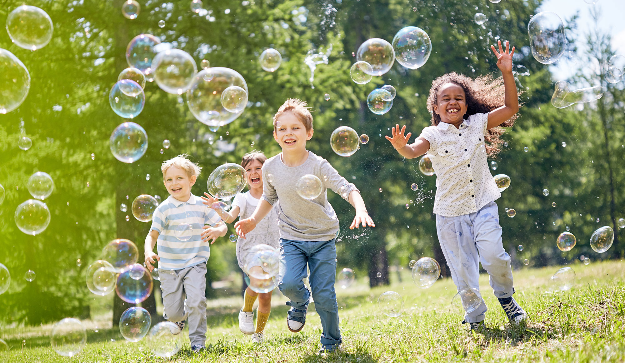 kids playing with bubbles